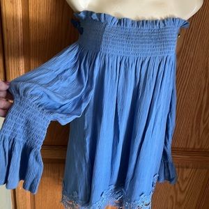 Cute Periwinkle blue cold off shoulder blouse. 100 rayon. Cute embroidered hem